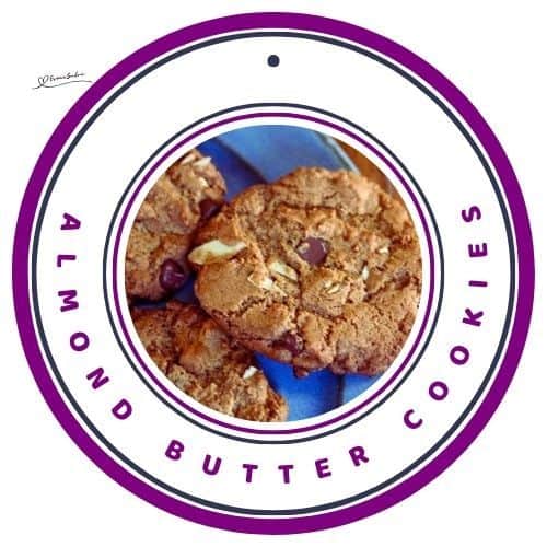 an image of a blue serving plate with Almond Butter Cookies