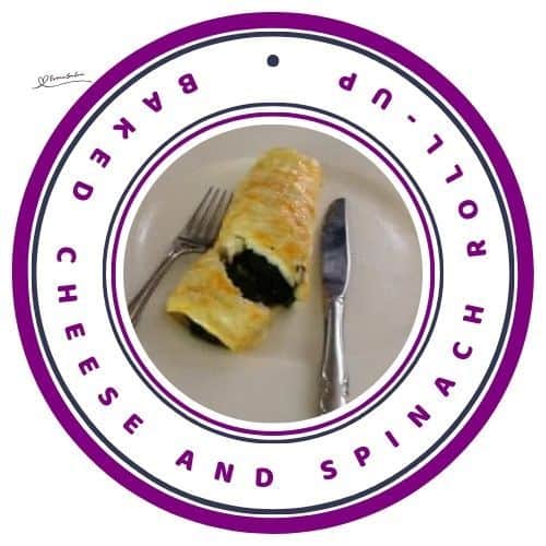 an image of a Baked Cheese and Spinach Roll-Up on a white plate with a knife and fork