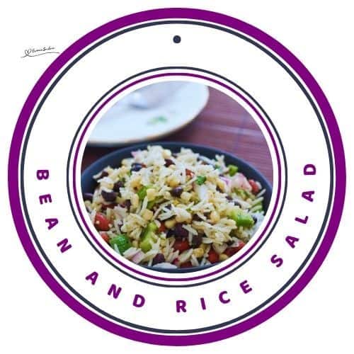 an image of a greenish ceramic bowl filled with Bean and Rice Salad