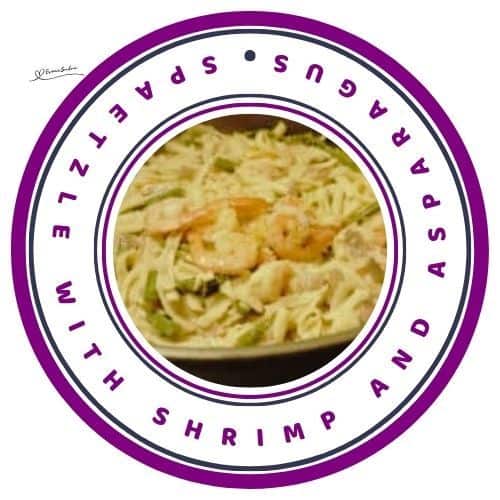 an image of a black serving dish with Spaetzle with Shrimp and Asparagus