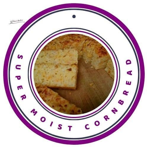 an image of a sliced Super Moist Cornbread on a wooden board