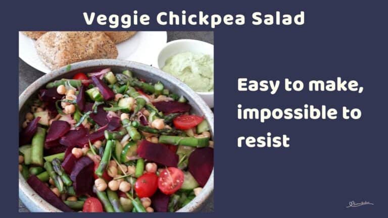 an image of a Veggie Chickpea Salad in a pottery serving dish