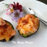 2 Avocado sliced in half filled with Shrimps and topped with cheese