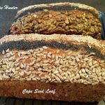 A loaf of bread covered with lines of seeds and called Cape Seed Loaf