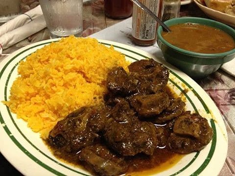 Oxtail served with Yellow rice