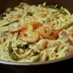 A bowl of Spaetzli with asparagus and shrimp