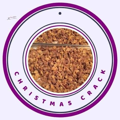 an image of a baking tray with Christmas Crack with Chex, Shreddies, golden syrup, coconut, pecans, and raisins