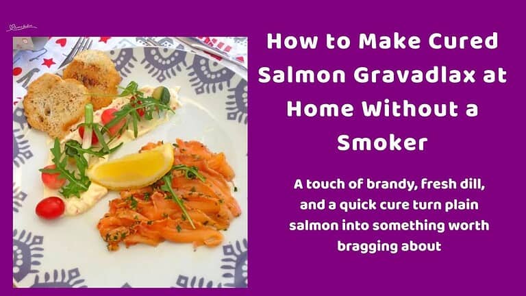 an image of Cured Salmon Gravadlax served with greens, tomato, lemon and croutons