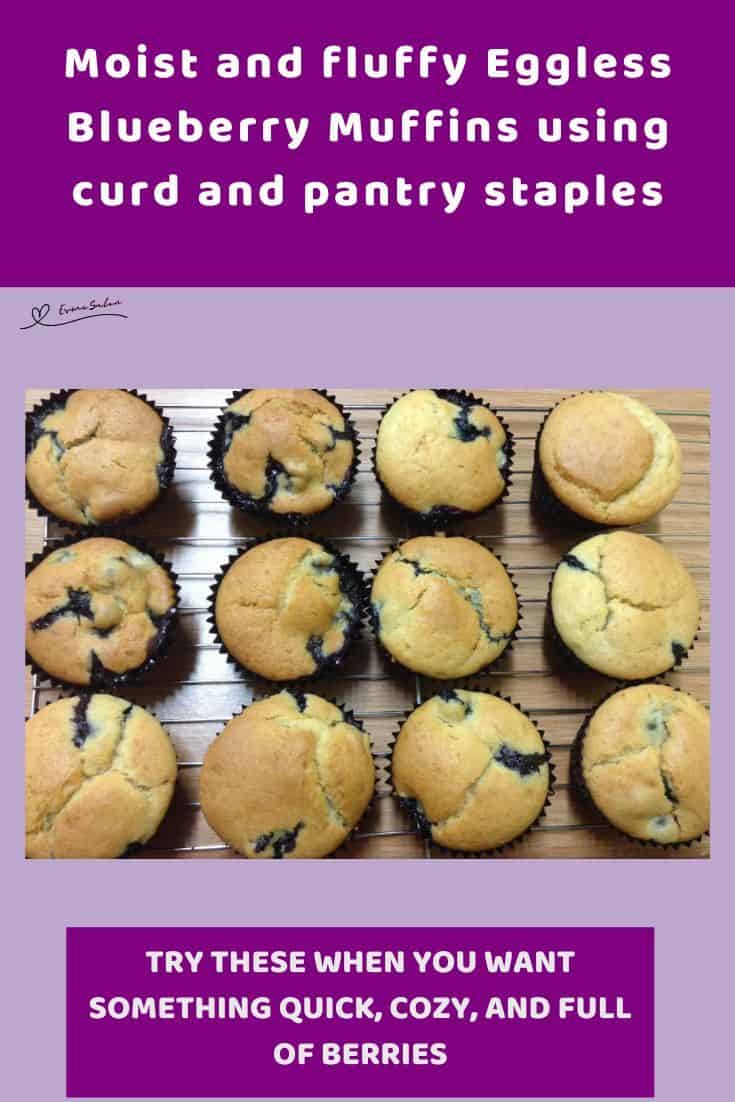 an image of Eggless Blueberry Muffins in paper cupcake holders on wire rack