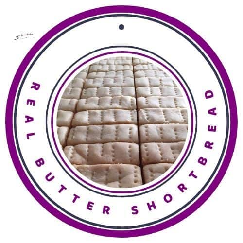 an image of a flat tray with Real Butter Shortbread sliced in finger strips and pricked