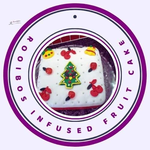 an image of a Rooibos Infused Fruit Cake covered with marzipan and marzipan decorations