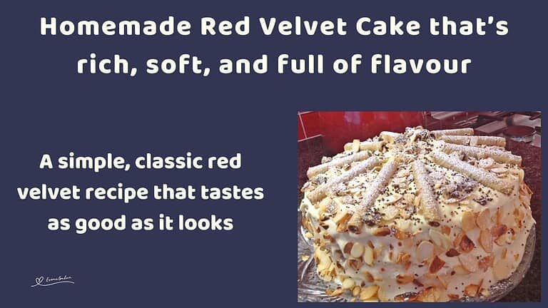an image of a Red Velvet Cake with cream cheese frosting and decorated with slivered almonds and chocolate curls
