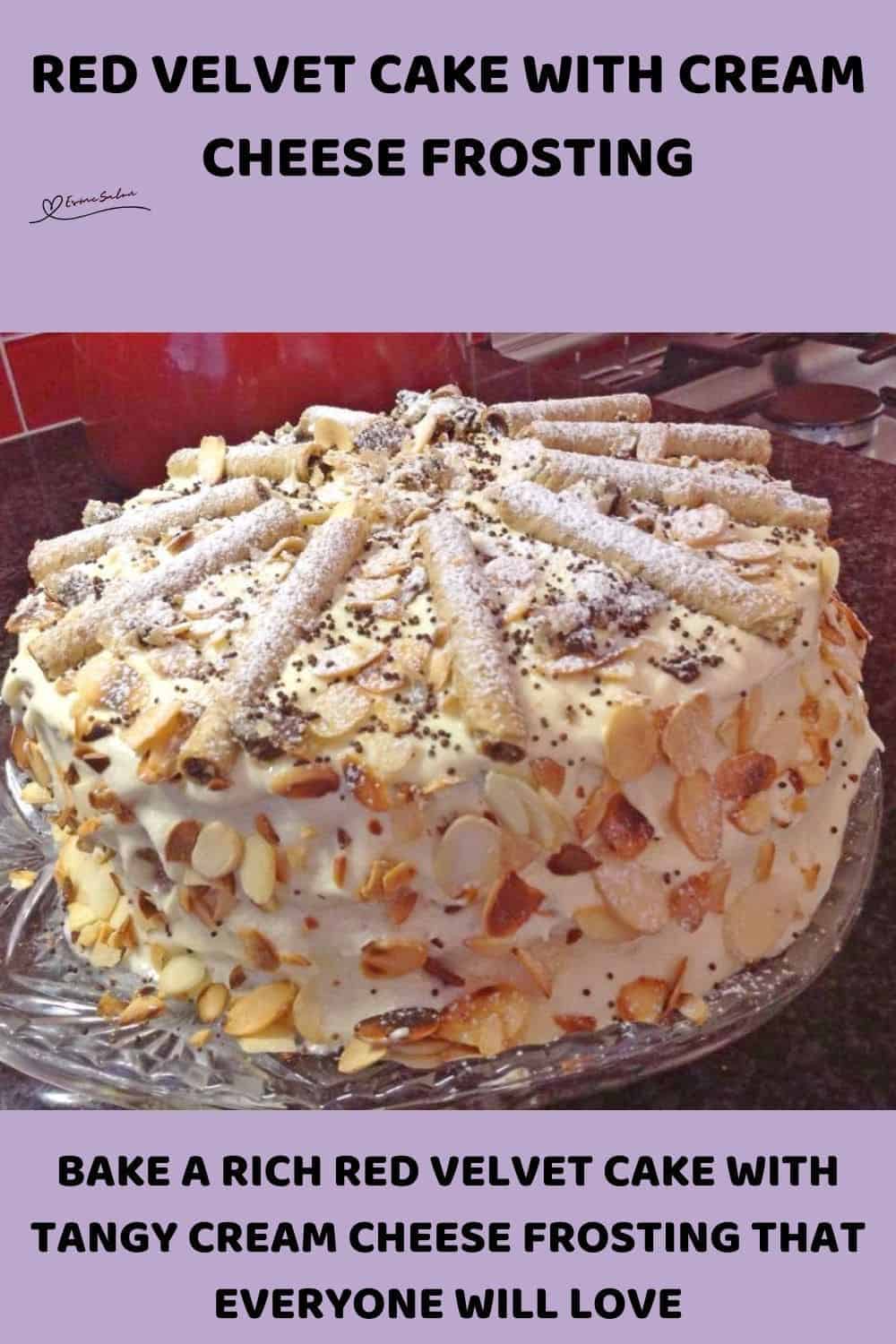 an image of a Red Velvet Cake with cream cheese frosting and decorated with slivered almonds and chocolate curls
