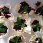 Phyllo Baskets filled with cream and blueberry coulis topped with sprigs of mint