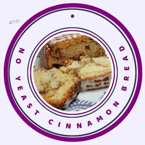 an image of a No Yeast Cinnamon Bread and slices on a mauve pattered platter