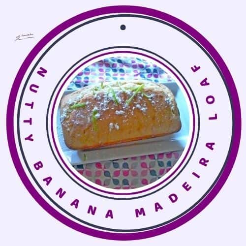 an image of a Nutty Banana Madeira Loaf topped with grated lemon rind