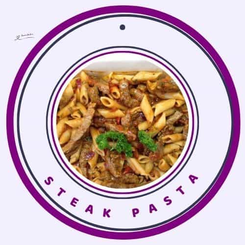 an image of a white platter with a Steak Pasta meal