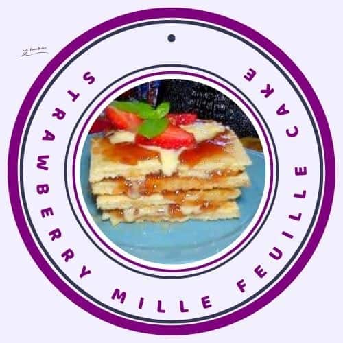 an image of a Strawberry Mille Feuille Cake on a blue plate and decorated with mint leave