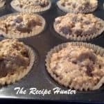 Batter of Banana Chia Seed Muffins in cupcake papers in muffin tin for baking