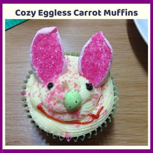 an image of Cozy Eggless Carrot Muffins decorated with bunny ears