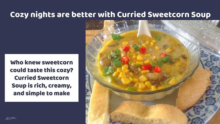 an image of a glass bowl with Curried Sweetcorn Soup and bread on the side