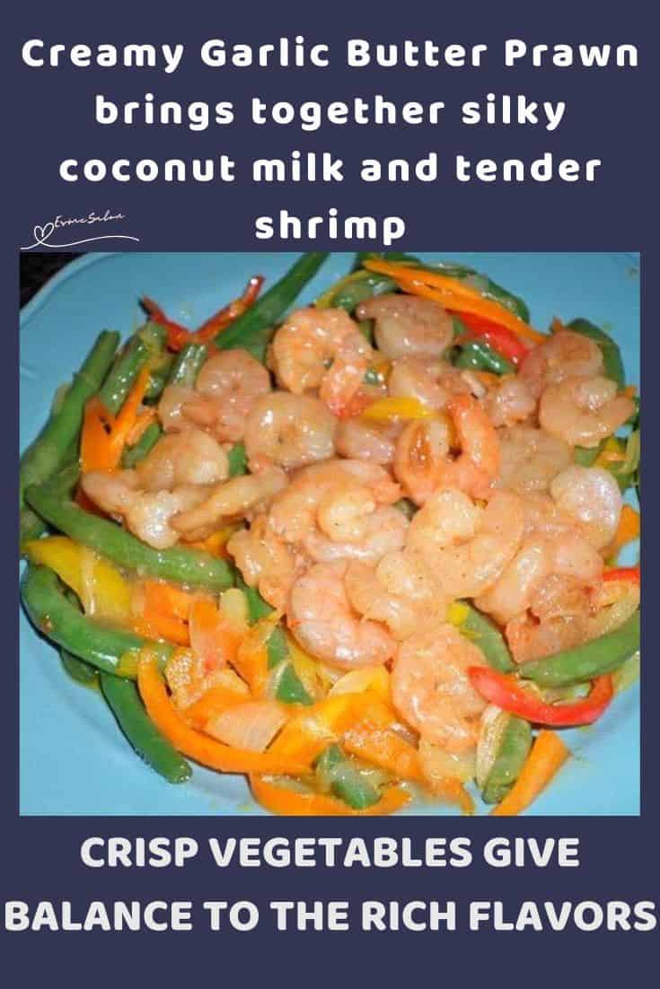 an image of Creamy Garlic Butter Prawns with veggies on a blue serving dish