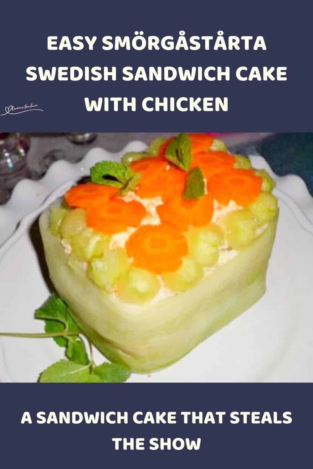 an image of a Smörgåstårta Swedish Sandwich Cake decorated with cucumber ribbons, cucumber balls, and carrot flowers