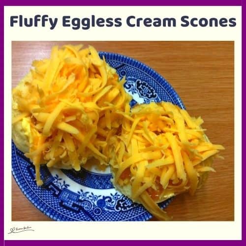 an image of Fluffy Eggless Cream Scones and some plated and topped with grated cheese