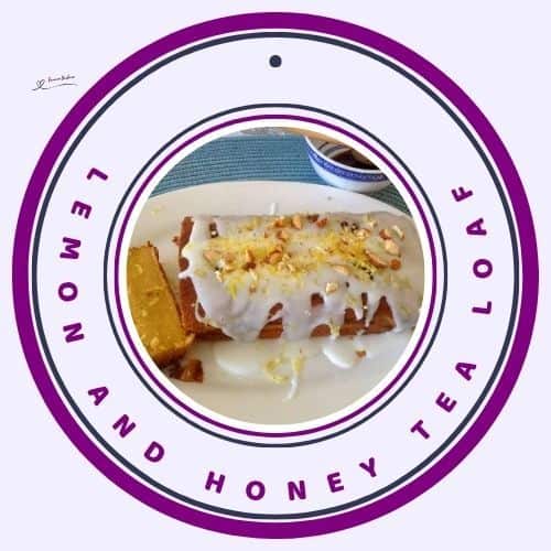an image of a Lemon and Honey Tea Loaf with lemon drizzle and lemon rind