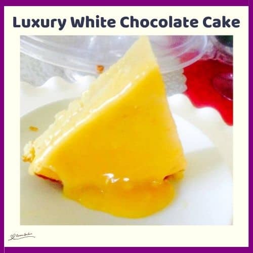 an image of a Luxury White Chocolate Cake on a white plate