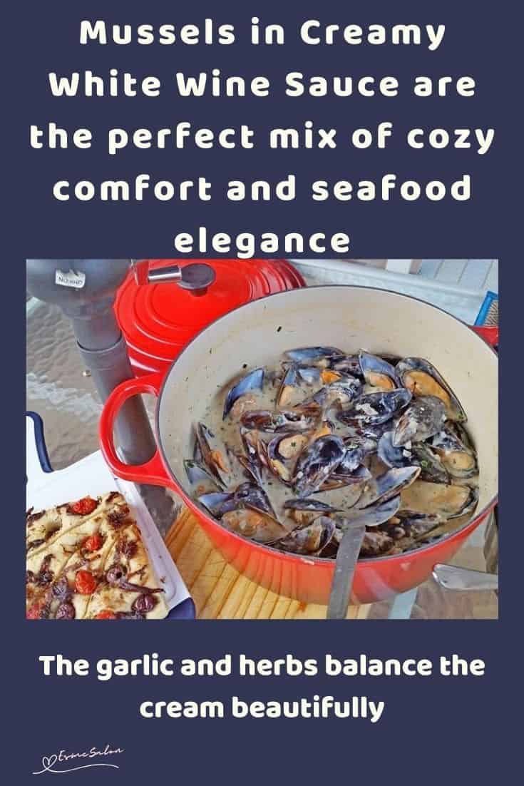 an image of a red cast iron pot with Mussels in Creamy White Wine Sauce