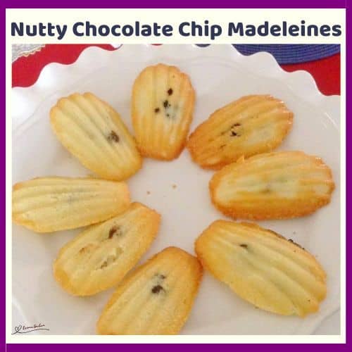 an image of 8 Nutty Chocolate Chip Madeleines displayed on a white plate