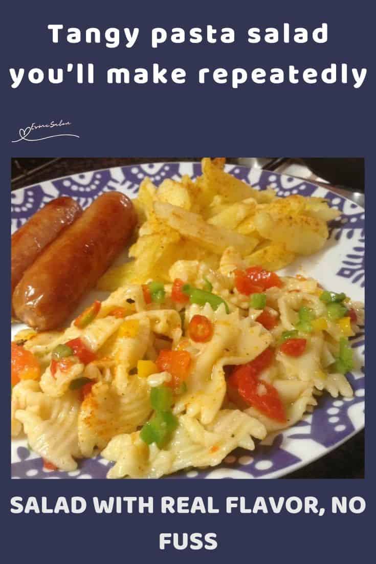 an image of a plate with Pasta Salad, grillers on the side