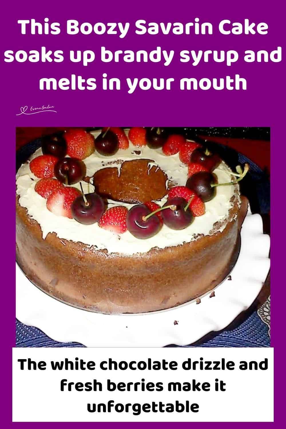 an image of a French-inspired Savarin Cake topped with white chocolate, cherries and strawberries