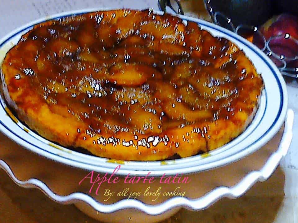 an apple tart in a round white plate