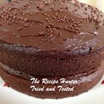 a naked double layer Avocado Chocolate Cake with Avocado Frosting