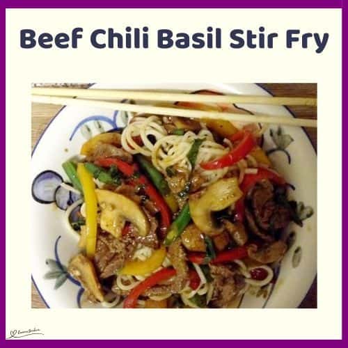 an image of a plate with Beef Chili Basil Stir Fry and chopsticks on the side