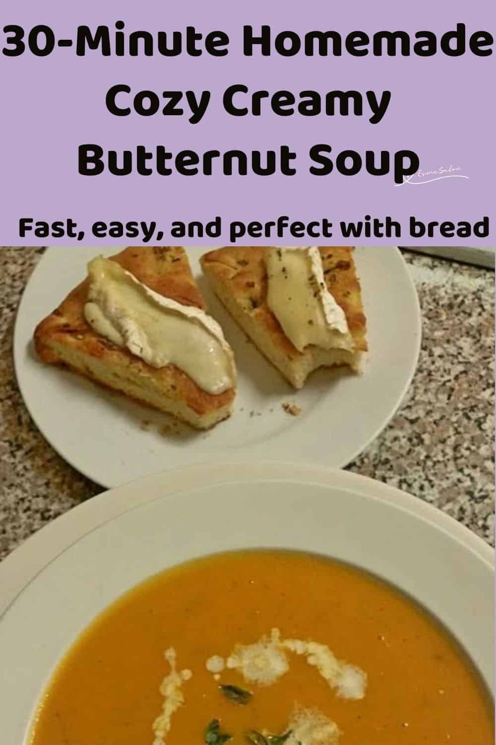 an image of a Cozy Creamy Butternut Soup in a white soup bowl with a drizzle or cream and greens