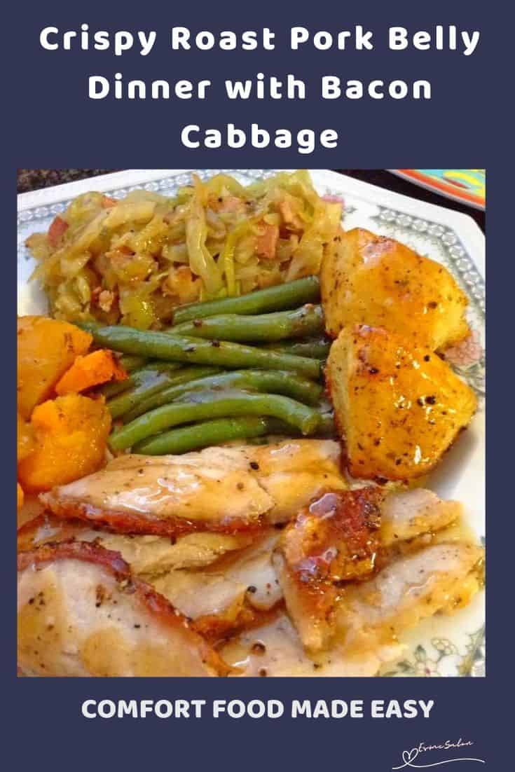 an image of a dinner plate with Crispy Roast Pork Belly, bacon cabbage, green beans and potatoes