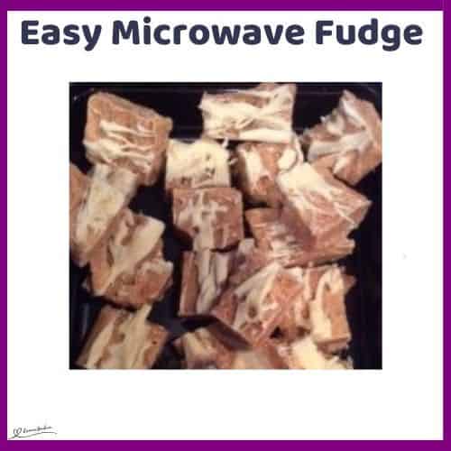 an image of brown Easy Microwave Fudge with white chocolate drizzled over the top