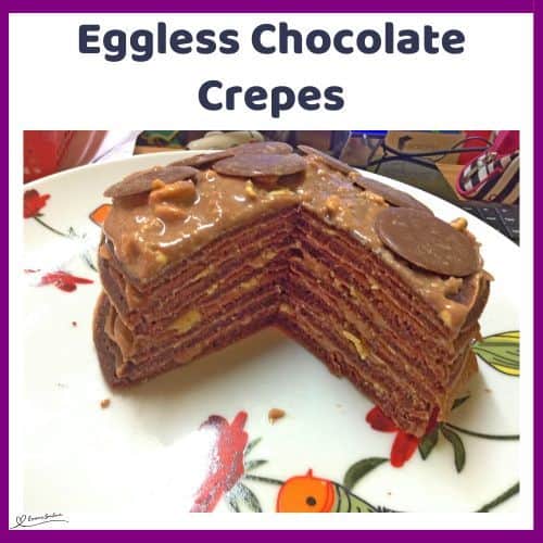 an image of a stack of Eggless Chocolate Crepes with chocolate buttons and chocolate cream cheese filling
