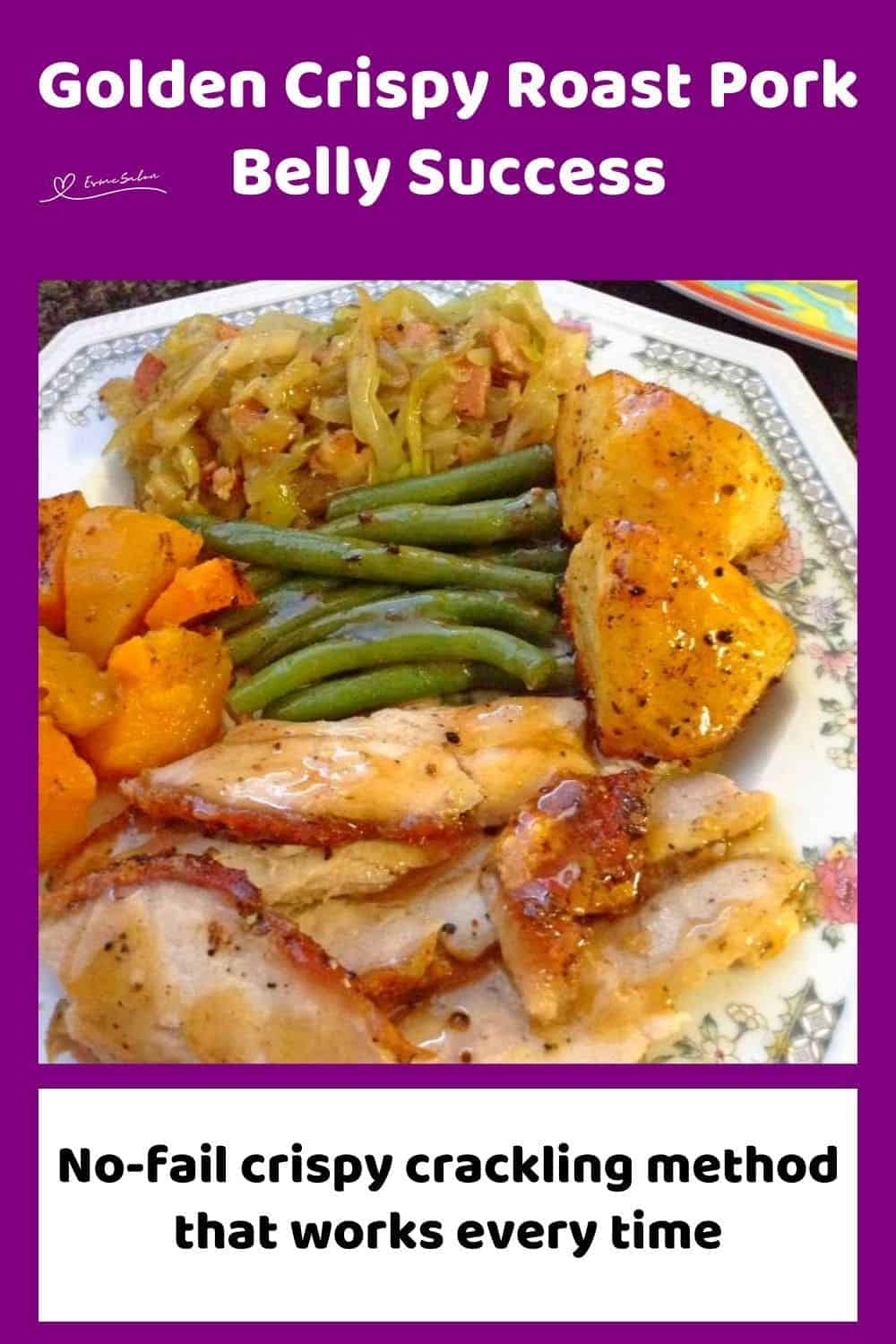 an image of a dinner plate with Crispy Roast Pork Belly, bacon cabbage, green beans and potatoes