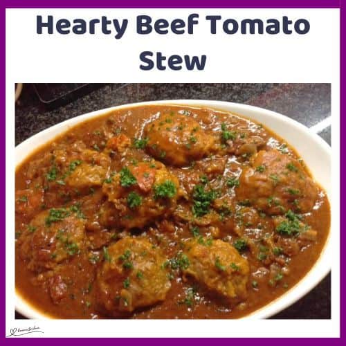 an image of an oval white platter with a Hearty Beef Tomato Stew and dumplings