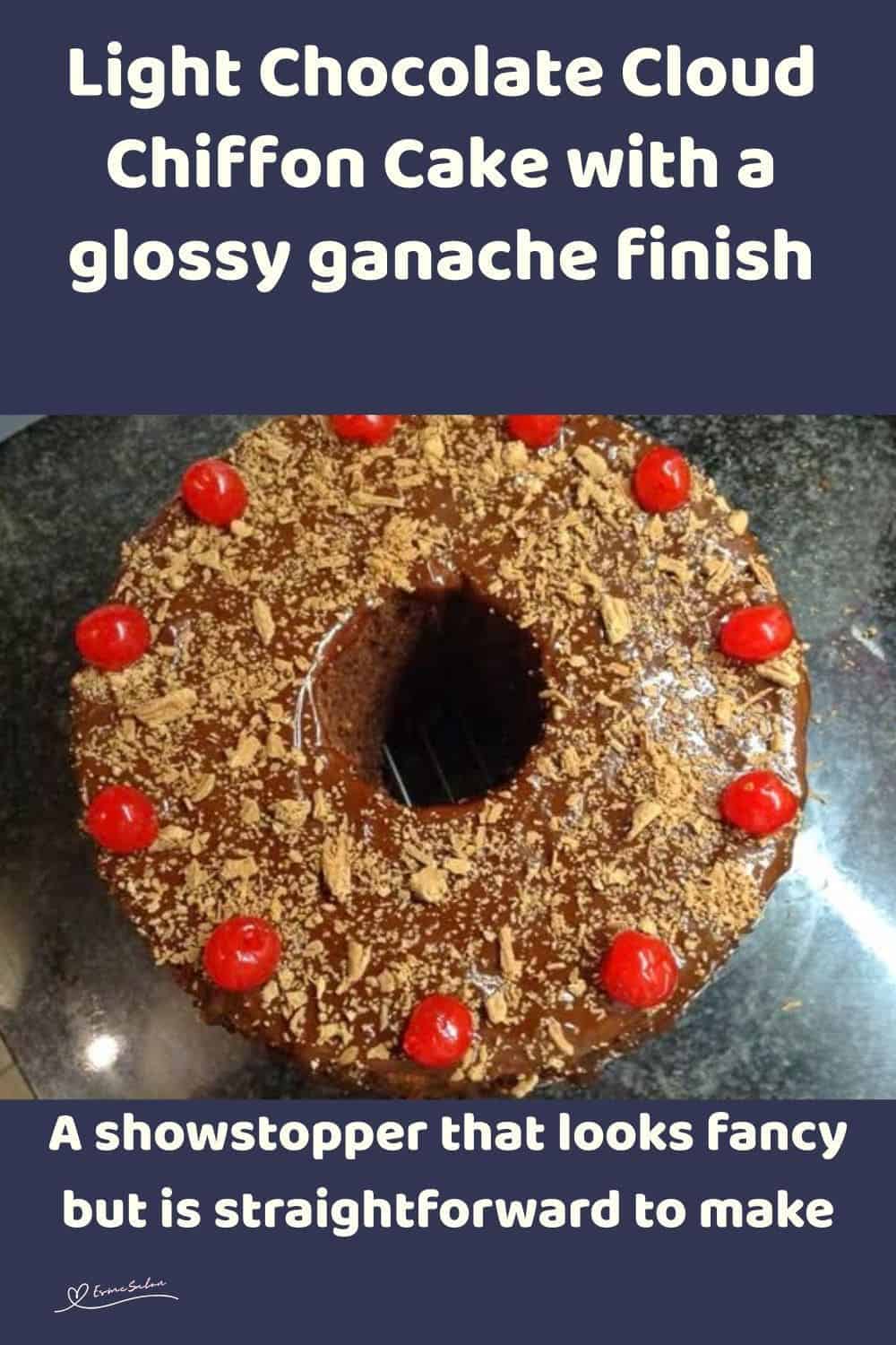 an image of a Chocolate Cloud Chiffon Cake decorated with flake chocolate and cherries