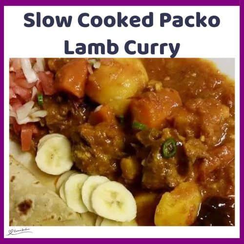 an image of a plate filled with Slow Cooked Packo Lamb Curry, served with sambals and roti