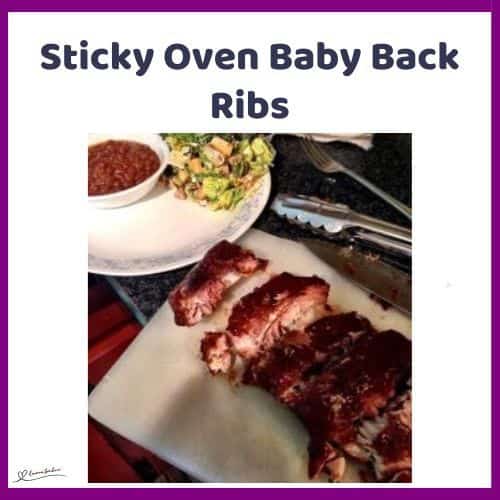 an image of Sticky Oven Baby Back Ribs on a white platter with a side of salad