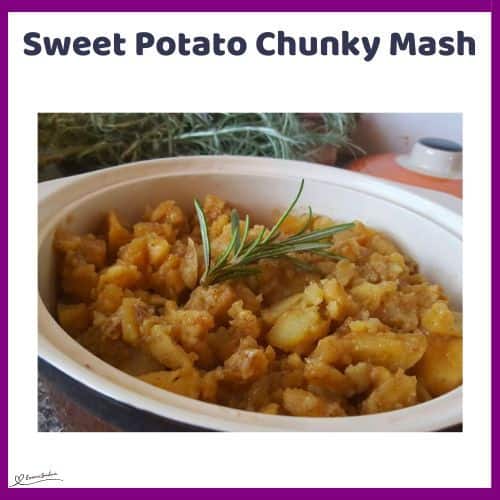 an image of a white dish with Sweet Potato Chunky Mash and a sprig of rosemary