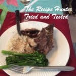 Beef Rib Roast served with rice, broccolini, and juice from the meat