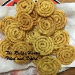 An Indian Murukku Treat, savory, crunchy snack and in a coil form