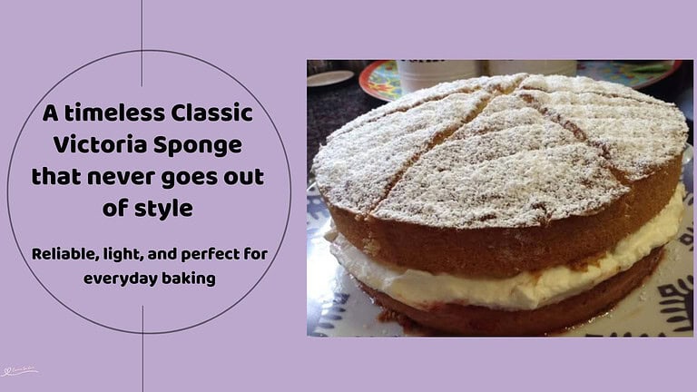 An image of a Classic Victoria Sponge with cream filling and dusted with icing sugar
